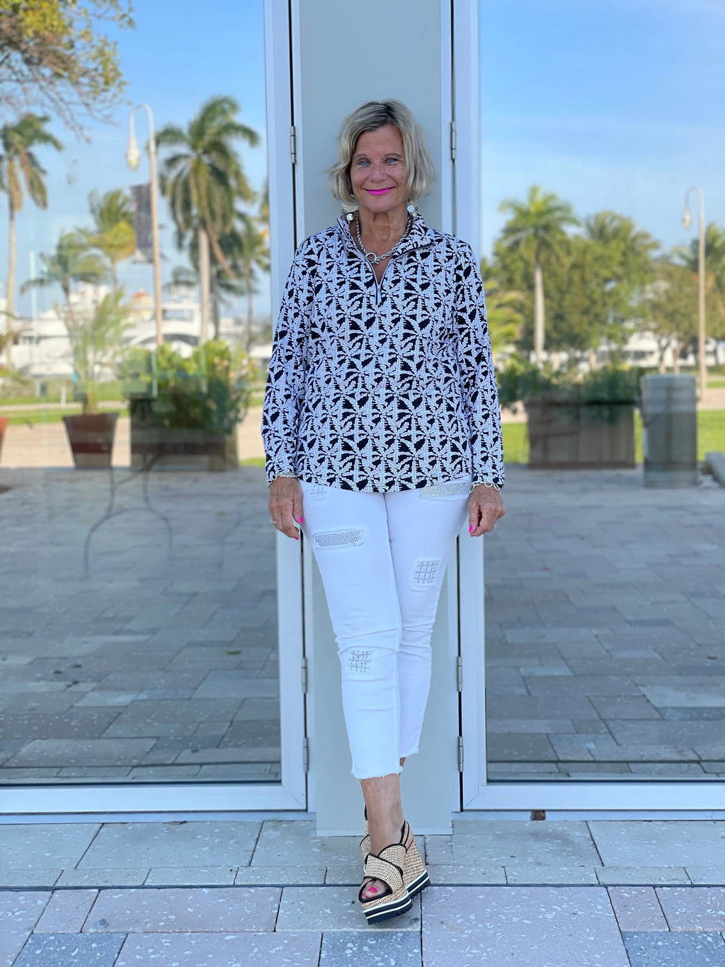 BLACK AND BEIGE PALM ZIPPER TOP