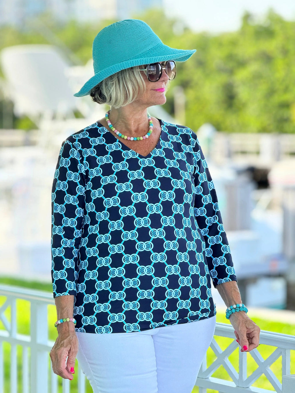 BLUE MEDALLION V NECK TOP
