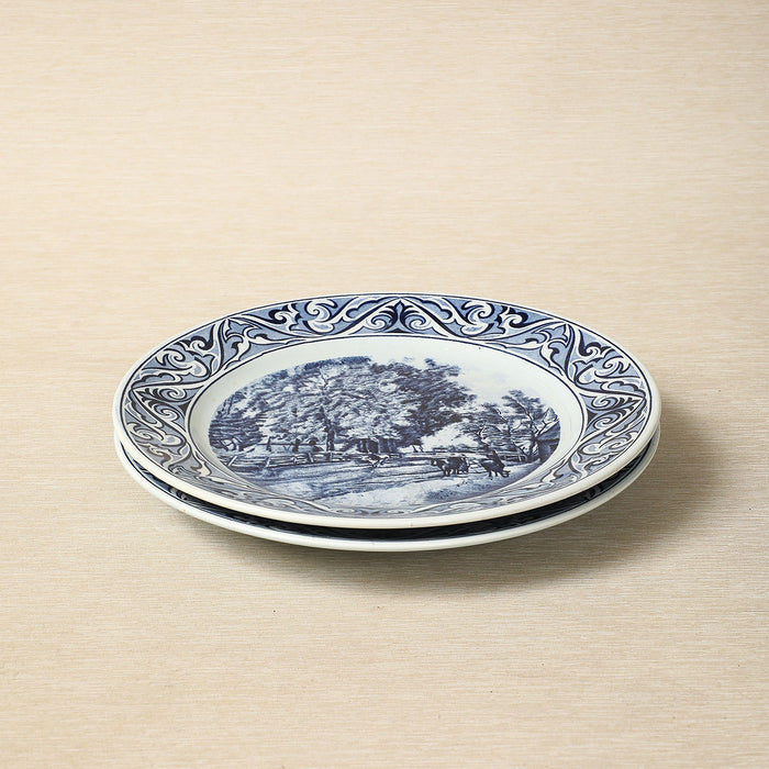 A Petrus Regout delft blue collector's plate featuring a seasonal landscape c. 1890