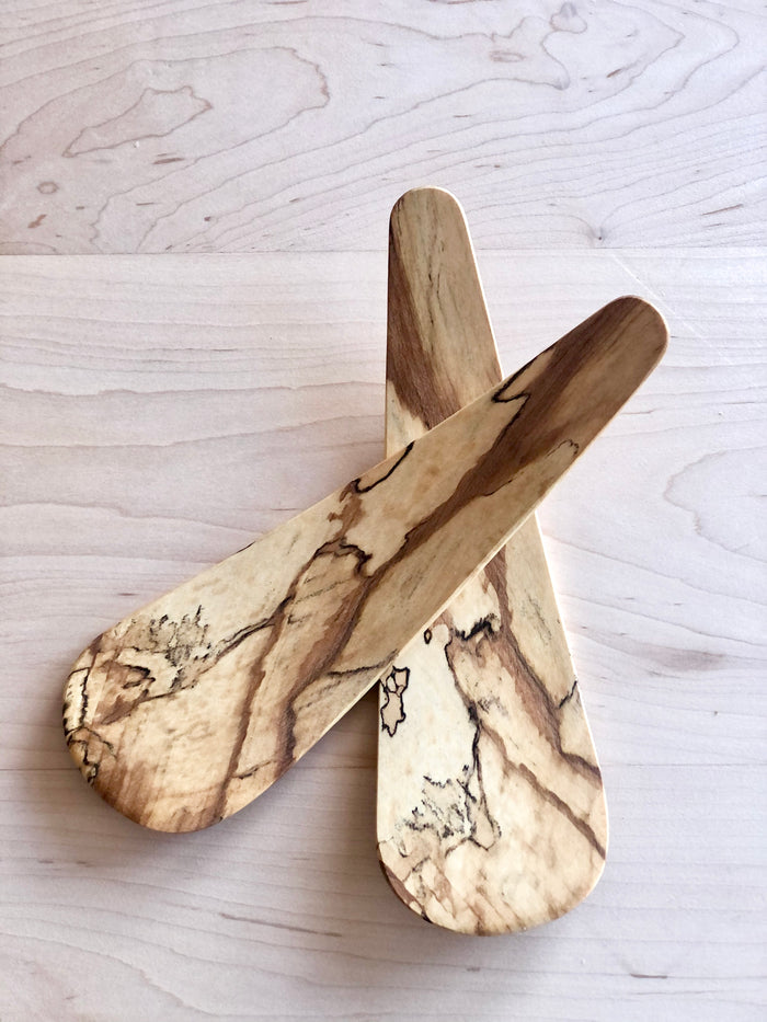 wooden salad servers close up maple wood on wood