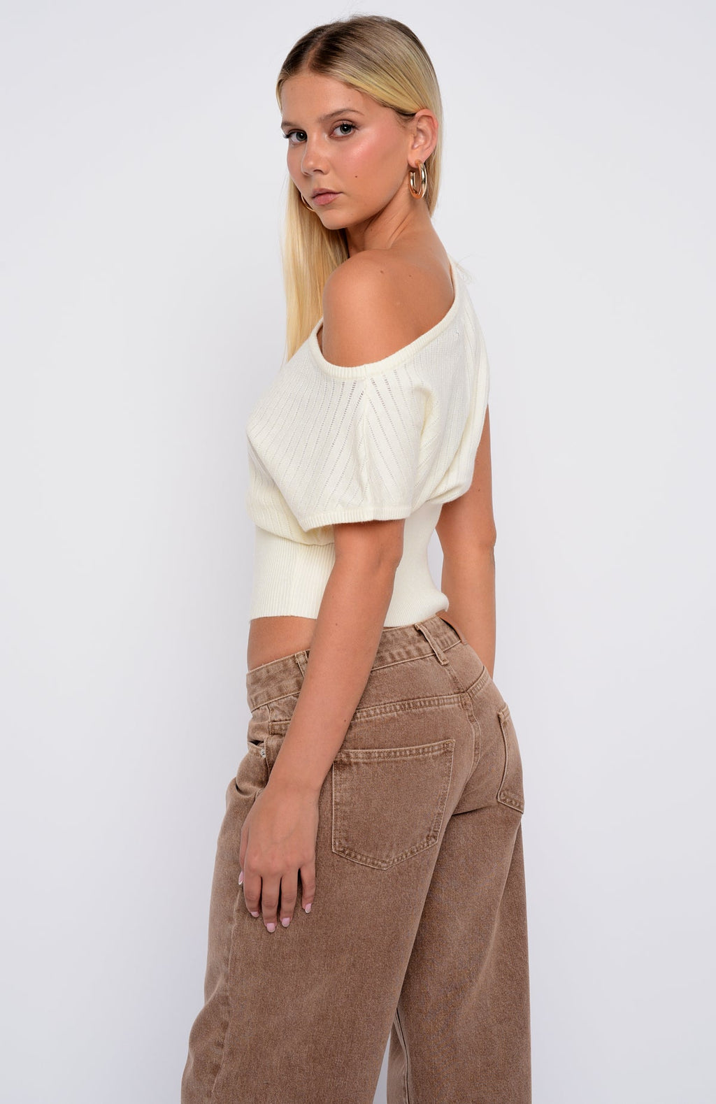 In A Spiral Cinched Waist Off Shoulder Knit Top Cream